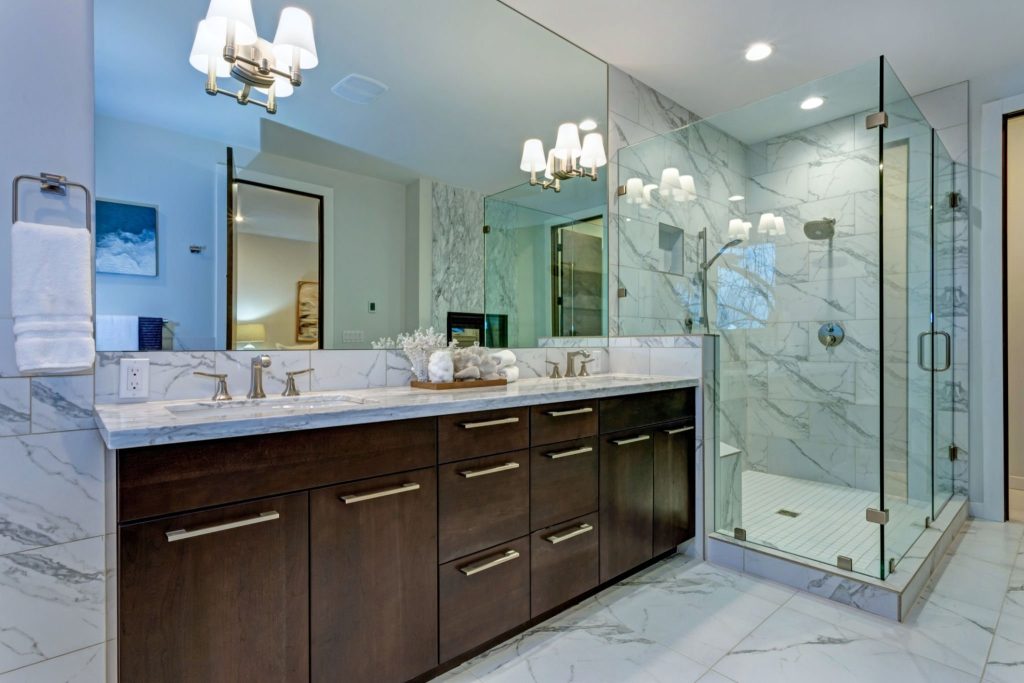 Frameless Shower Stall and White Tub